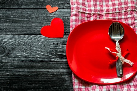 beautiful dining set on Valentine,laying on wooden background,holiday conceptの写真素材