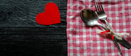 beautiful dining set on Valentine,laying on wooden background,holiday conceptの写真素材