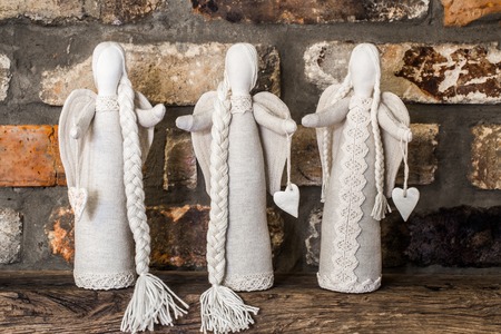 Beautiful soft toys angels in the form of people, the concept of celebration and familyの写真素材