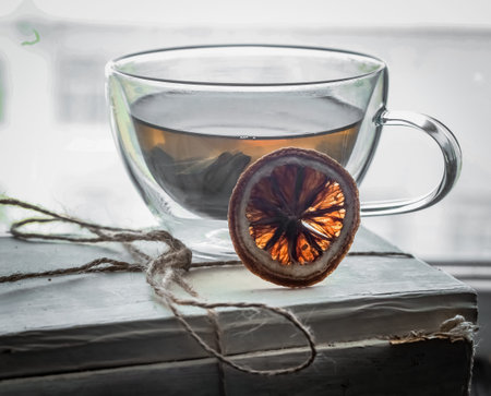 transparent Cup on the background of the window is on a white paperの写真素材