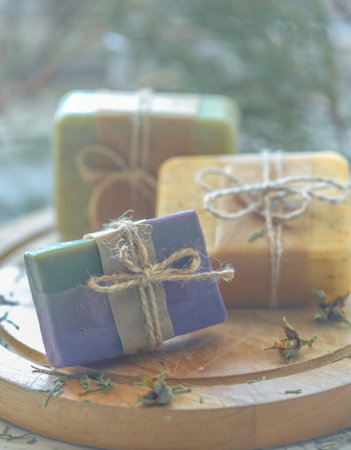 beautiful, fragrant handmade soap lies on a circular base on a wooden background