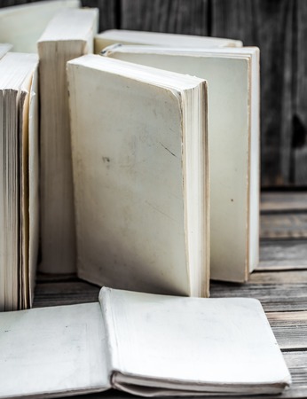 the white book on wooden background with space for text, concept of knowledge and informationの写真素材