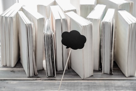 white paper on wood background with space for text, concept of knowledge and informationの写真素材
