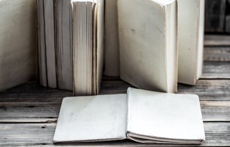 the white book on wooden background with space for text, concept of knowledge and informationの写真素材