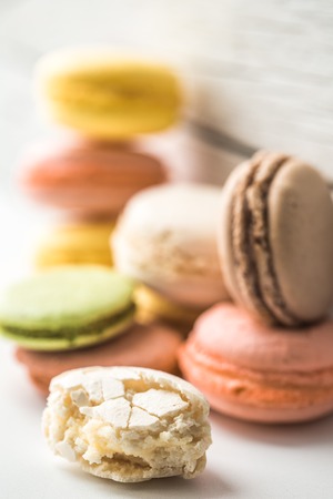 Multicolored macaroons on a beautiful wooden background ,concept of sweets and celebrationの写真素材