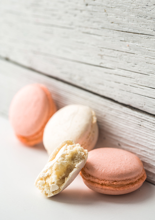 Multicolored macaroons on a beautiful wooden background ,concept of sweets and celebrationの写真素材
