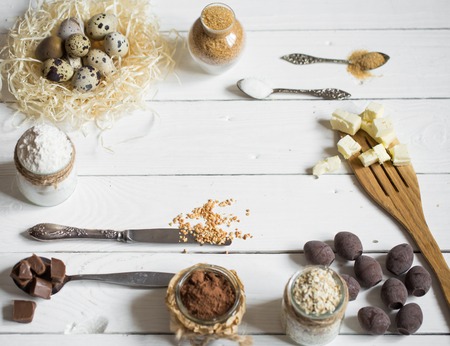 Easter different ingredients on white wooden table,holiday concept and preparationの写真素材