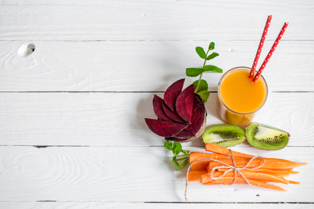 the fresh juice with fruits on a white wooden background,concept of healthy nutrition and foodの写真素材