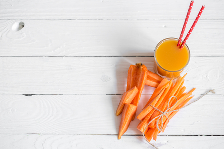 the fresh juice with fruits on a white wooden background,concept of healthy nutrition and foodの写真素材