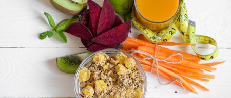 healthy Breakfast with juice and fruit on white wooden background,concept of healthy nutrition and...