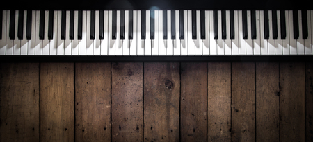 piano on wooden background closeup ,concept musical instrumentsの写真素材