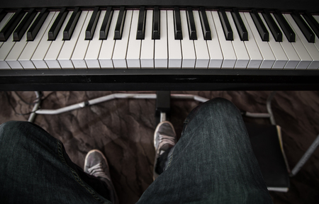 the guy playing the synthesizer closeup ,concept musical instrumentsの写真素材