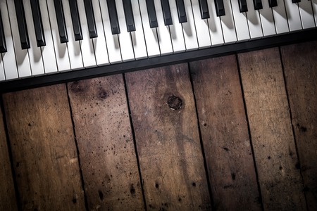 piano on wooden background closeup ,concept musical instrumentsの写真素材