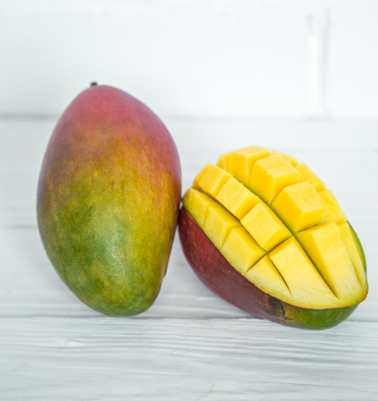 Mango on a white wooden backgroundの写真素材
