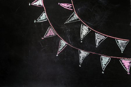 drawing chalk flags on the black backgroundの写真素材