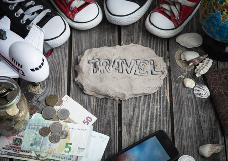 Items of a traveler on a wooden background ,space for text,concept of leisure and travelの写真素材