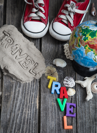 Items of a traveler on a wooden background ,space for text,concept of leisure and travelの写真素材