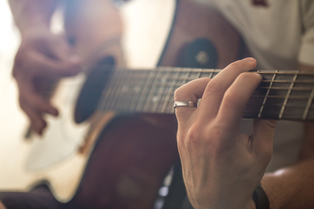 the guy playing the acoustic guitarの写真素材