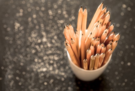 the stack of pencils in a white Cup on black background,closeup ,macro ,backgroundの写真素材