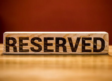 wooden sign saying reserved,close-up ,background ,concept hotels and restaurants