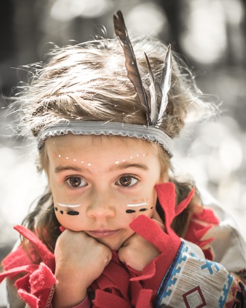 portrait of girl in costume of American Indianの写真素材
