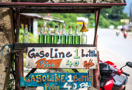 selling gasoline in glass bottles on Koh Chang, Thailandの写真素材
