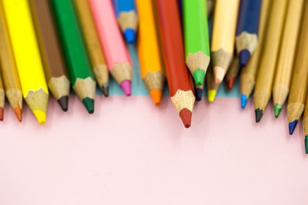 Large colored pencils close-up on a colored background with colored pencilsの写真素材