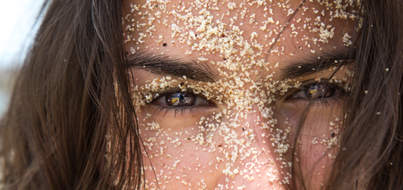 portrait of a girl in the sand concept of summer and beachの写真素材