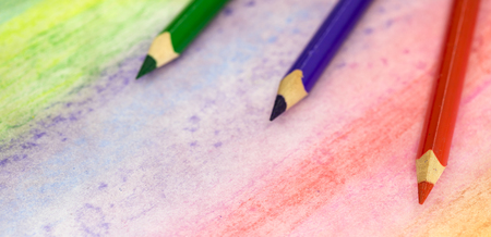 Large colored pencils close-up on a colored background with colored pencilsの写真素材