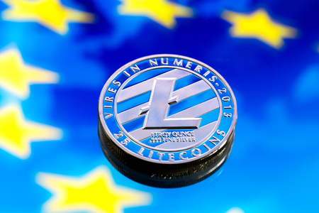 coins litecoin, against the background of Europe and the European flag, the concept of virtual money, close-up. Conceptual image of digital crypto currency.の写真素材