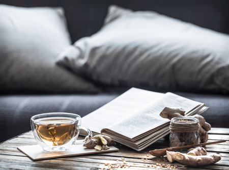 slippers in the living room at the couch and tea on the wooden table, Cozy home atmosphereの写真素材
