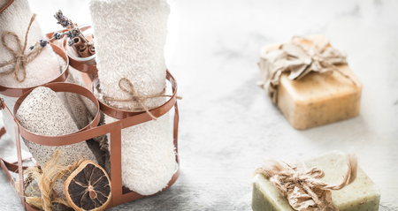 Spa composition with handmade soap in a beautiful stand on a light backgroundの写真素材