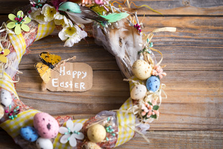 Easter wreath with eggs on a wooden background, concept of holidays