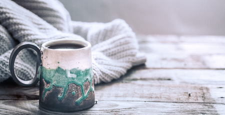 composition with a beautiful handmade cup on a wooden backgroundの写真素材