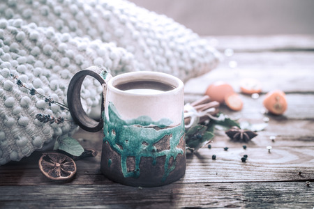 still life a cozy cup of tea with kumquat on a wooden background, the concept of coziness and pastimeの写真素材