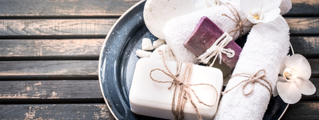 still life of spa with handmade soap on a beautiful wooden background, concept of spa relaxation and wellness proceduresの写真素材
