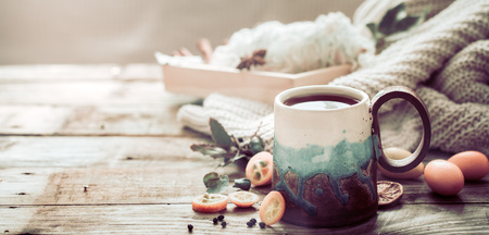 still life a cozy cup of tea with kumquat on a wooden background, the concept of coziness and pastimeの写真素材