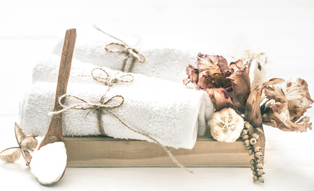 Spa still life of natural ingredients in a wooden box on a white background, the concept of relaxation and spa proceduresの写真素材