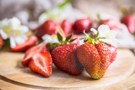 Fresh strawberries in jars on a wooden backgroundの写真素材