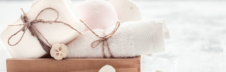 Spa still life of soap in a wooden box on a light background, space for text