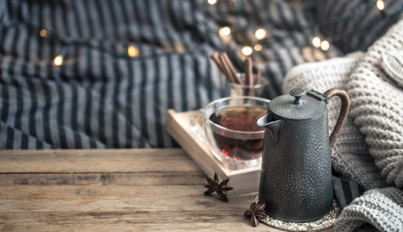 morning breakfast in bed with a cup of tea on a wooden background in the bedroom interiorの写真素材