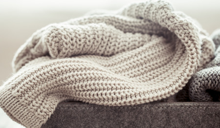 knitted warm sweaters, cozy composition in the home atrosphereの写真素材