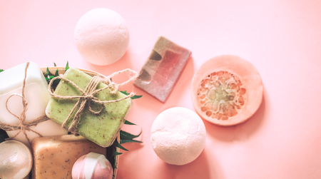 spa composition soap with salt bombs on a pink background, the concept of relaxation and body careの写真素材