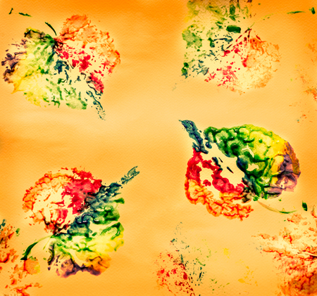 Autumn children's drawings with colorful paints on a yellow backgroundの写真素材