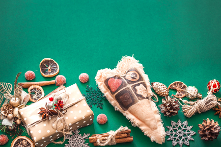Christmas composition on green background, gift box and decorの写真素材