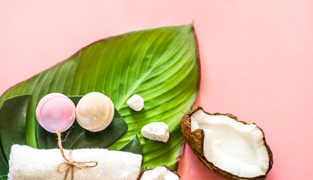 Beautiful Spa composition with the coconut on a pink background, the concept of beauty and health