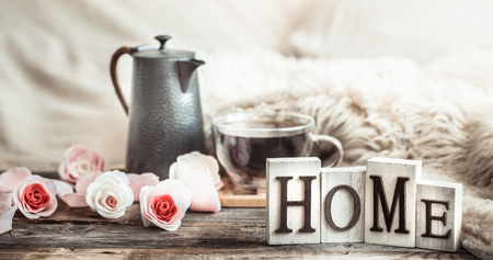 home atmosphere in the interior with wooden letters and home decor items, comfort conceptの写真素材