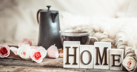 home atmosphere in the interior with wooden letters and home decor items, comfort conceptの写真素材