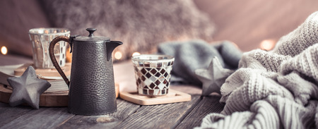 Still life cozy home, interior details in the living room on a wooden table, the concept of home comfort and careの写真素材