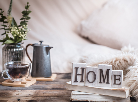 home atmosphere in the interior with wooden letters and home decor items, comfort conceptの写真素材